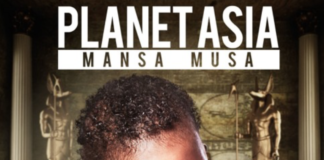 Planet Asia Mansa Musa Cover Art Baby laying on tummy in pile of gold wearing a medallion with "P.A." on it inside of egyptian tomb