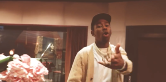Tyler the Creator screen shot of himself in a hat and sweater for "435" video